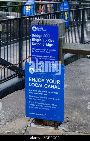 Canal and Riverside Trust notices at the top of Five Rise Locks in Bingley, West Yorkshire. The locks are located on the Leeds Liverpool canal. Stock Photo