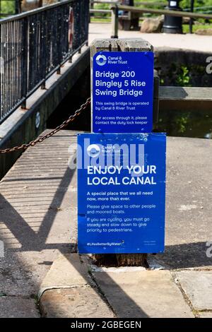 Canal and Riverside Trust notices at the top of Five Rise Locks in Bingley, West Yorkshire. The locks are located on the Leeds Liverpool canal. Stock Photo