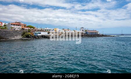 Ample panoramic views of the small resort with beautiful traditional architecture, local fish restaurants and tranquil atmosphere, La Caleta, Tenerife Stock Photo