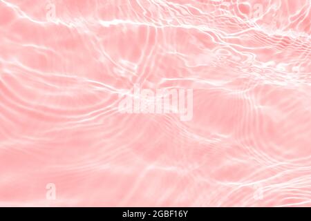 Pink water surface with bright sun light reflections, water in swimming  pool background Stock Illustration