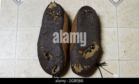 A High Angle View of Worn Out Slippers Stock Photo