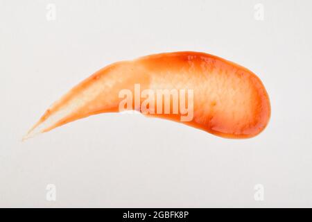 red ketchup splashes isolated on white background, tomato puree texture Stock Photo