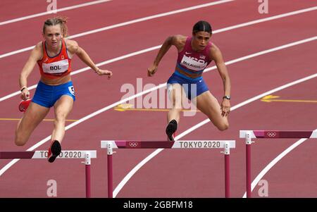 USA's Sydney McLaughlin on the way to winning the gold medal in the Women's 400m Hurdles, alongside Netherlands' Femke Bol who finished third at the Olympic Stadium on the twelfth day of the Tokyo 2020 Olympic Games in Japan. Picture date: Wednesday August 4, 2021. Stock Photo