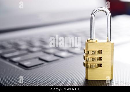 padlock on laptop's keyboard concept. Stock Photo