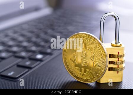 Bitcoin With Padlock On Keyboard, Cryptocurrency Security Concept Stock Photo