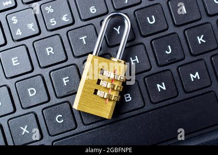 Computer security concept. Padlock on computer keyboard. Selective focus. Stock Photo