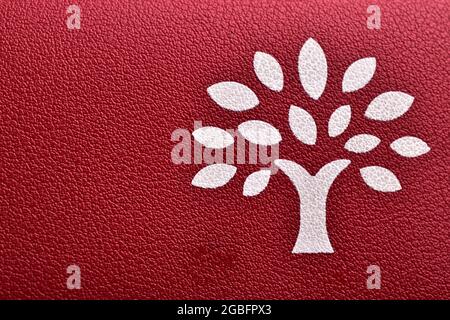Tree Logo Printed On Nature Leather, Eco-Friendly Leather Or synthetic leather Stock Photo