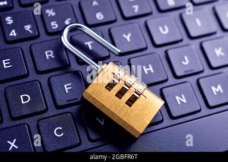 Unlocked padlock on computer keyboard , Cyber safety concept. Privacy, data breach concept Stock Photo