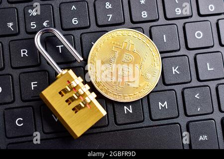 digital currency, bitcoin with padlock on keyboard Stock Photo