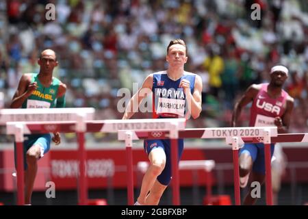 Tokyo, Japan, 04/08/2021, dos SANTOS Alison (BRA), WARHOLM Karsten (NOR), and BENJAMIN Rai (USA), World Record Time AUGUST 3, 2021 - Athletics : Norway's Karsten Warholm sets a new World Record during the Men's 400m Hurdles Final during the Tokyo 2020 Olympic Games at the Olympic Stadium in Tokyo, Japan. USA's Benjamin Rai also ran faster than - while Brazil's Alison dos Santos just missed - the previous world record. Credit: Naoki Nishimura/AFLO SPORT/Alamy Live News Stock Photo