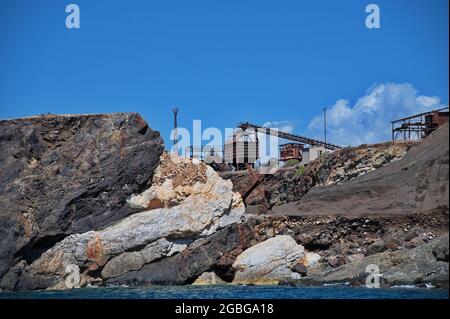 Old iron ore mine on the rocks of Elba island Stock Photo