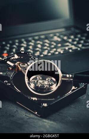 Open Hard drive on keyboard of laptop or notebook in dark tone Stock Photo
