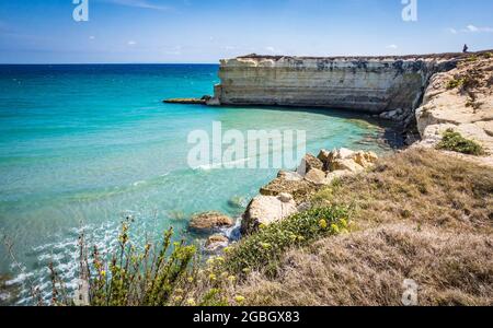 The Punticeddha Beach or Spiaggia Punticeddha of Sant'Andrea, Salento Adriatic sea coast, Apulia, Italy. Beautiful shore with cliffs and rocks of Puglia. Blue water, Summer day, top view Stock Photo