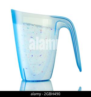 Washing laundry detergent powder and blue plastic measuring cup, top view  Stock Photo - Alamy