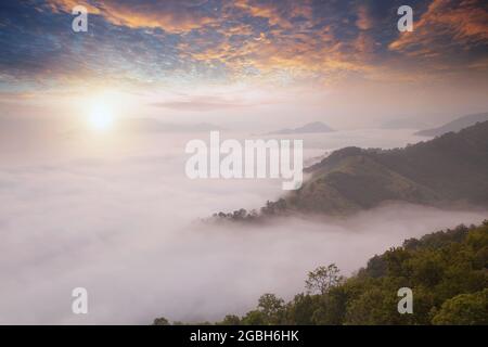 Mountain landscape and cloud carpet at sunrise, Thailand Stock Photo