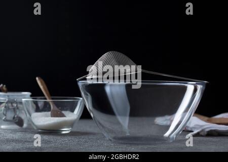 Empty transparent bowl and dishes on the kitchen table. Close-up Stock Photo