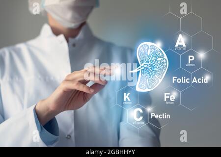 Essential nutrients for Spleen health including Pectin, Folic Acid, Vitamin P, Ferrum. Blurred portrait of doctor holding highlighted blue sketchy dra Stock Photo