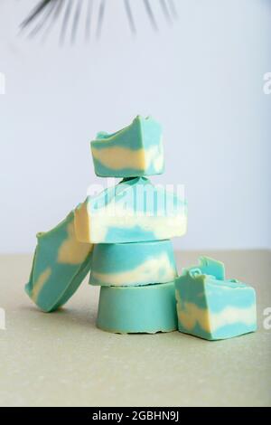 Solid shampoo bar many blue mint natural handmade soap bars in Tower stack shape. Organic soap bath beauty cosmetic products for hair body skincare Stock Photo