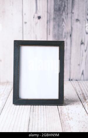 empty frame on wooden background . Stock Photo