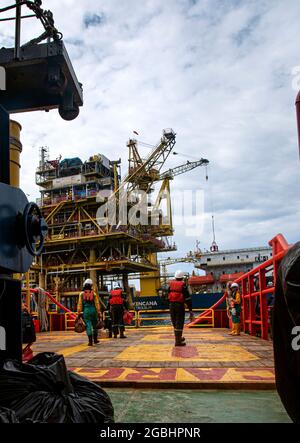 marine crew stand by on deck vessel for personal transfer from platform to vessel