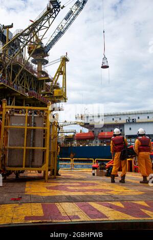 marine crew stand by on deck vessel for personal transfer from platform to vessel