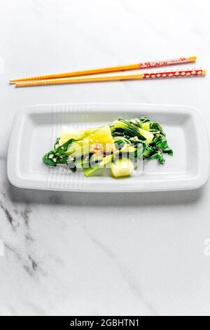 Stir-Fried Pak Choi in Asian Dish on a Clean Background with COPYSPACE - FOODPIX WHITE Stock Photo