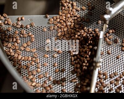 Cooling tray with freshly roasted coffee beans Stock Photo