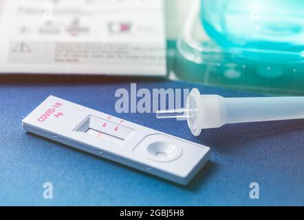 Covid 19 antigen self test for nasal swab with positive result. Antigen test kit for home use to detection coronavirus infection. Negative test result Stock Photo