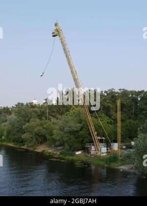 Bungee jumping from a crane in Kiev, on the banks of the Dnieper River Stock Photo