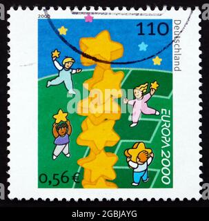 GERMANY - CIRCA 2000: a stamp printed in the Germany shows Children and Stars, circa 2000 Stock Photo