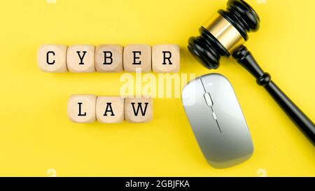 Selective focus on the gavel, keyboard and mouse with a text Cyber Law. Law legal technology concept. Stock Photo