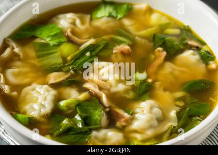 Homemade Asian Chicken Wonton Soup with Bok Choy Stock Photo