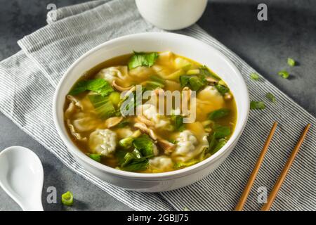 Homemade Asian Chicken Wonton Soup with Bok Choy Stock Photo