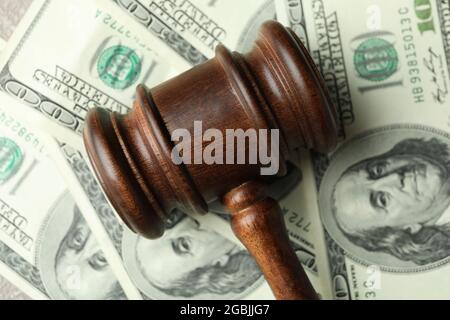 Judge gavel on dollar bills background, close up Stock Photo