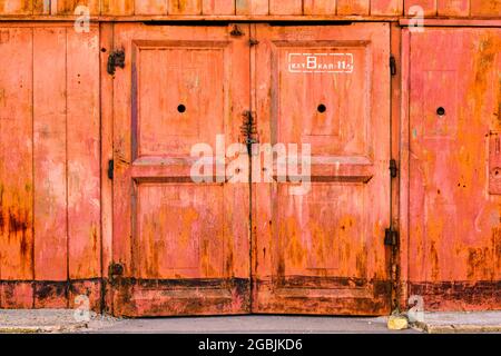 colorful old rusty metal door in stock Stock Photo