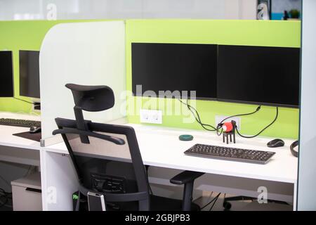 Belarus, the city of Gomel, May 06, 2021. Central office in the area.Workplace of a programmer or designer. There are two monitors on the table. Stock Photo