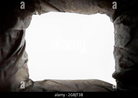 Trash can with black trash bag bottom view. view from the trash. Stock Photo