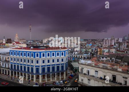 Thunder storm and rain clouds above Havana rooftops and Hotel Telegrafo in Habana Vieja, Old Havana, Cuba Stock Photo