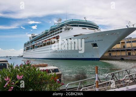 Venice, Italy - June 13, 2016:  Rhapsody of the Seas, cruise ship from Royal Caribbean, anchored for the day in Port Venice, Italy. Stock Photo