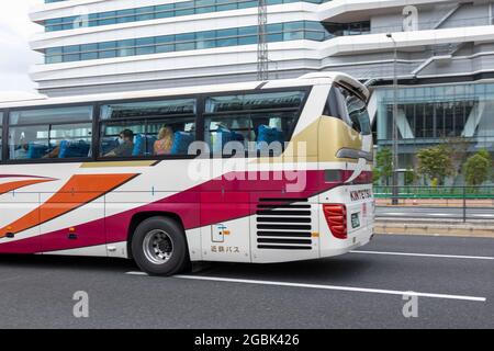 Tokyo, Japan. 26th July, 2021. Athletes seen a bus driving towards to the Olympic Village in Tokyo. Credit: SOPA Images Limited/Alamy Live News Stock Photo
