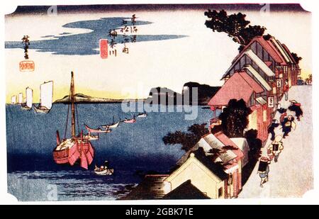This 1920 image shows Hiroshige’s  Kanagawa on the Tokaido. This is the forst station of Kanagawa, from the series 'Fifty-three Stations of the Tokaido (Tokaido gojusan tsugi),' also known as the Tokaido with Poem (Kyoka iri Tokaido). It was painted between 1832-1847. Utagawa Hiroshige, born Andō Hiroshige, was a Japanese ukiyo-e artist, considered the last great master of that tradition. Hiroshige is best known for his horizontal-format landscape series The Fifty-three Stations of the Tōkaidō and for his vertical-format landscape series One Hundred Famous Views of Edo. Stock Photo