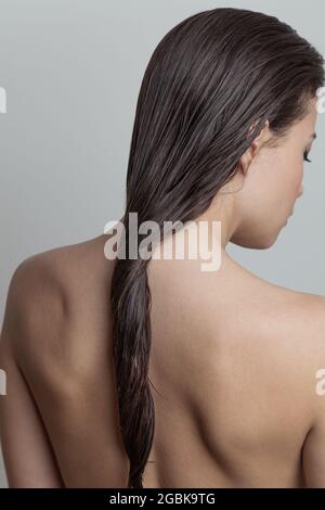 woman with wet hair rear view  focus on hair Stock Photo