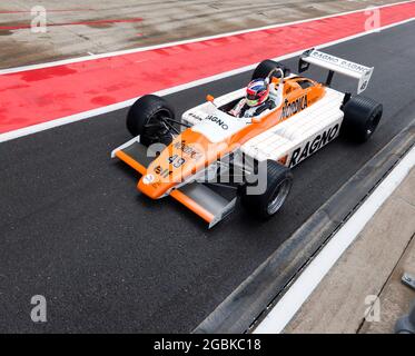 Niel Glover driving his 1982, Arrows A5 down the International Pit Lane, at the end of the Murray Walker Memorial Trophy for Masters Historic F1 Race Stock Photo