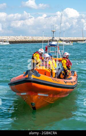 RNLI inshore lifeboat, inflatable lifeboat, lifesaving, saving lives at sea, marine safety, maritime rescue services, cowes isle of wight, uk Stock Photo