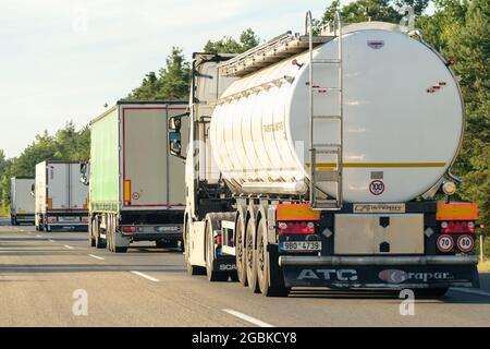Tank truck and lorry trucks driving on the road, July 2021, Zagreb, Croatia Stock Photo