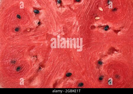 Juicy ripe red watermelon texture. Summer fruit watermelon texture. Juicy watermelon texture for a healthy diet concept. Stock Photo