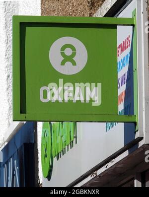 BILLERICAY, UNITED KINGDOM - Jun 13, 2021: A vertical shot of Oxfam charity shop sign on the High Street, Billericay, Essex, UK Stock Photo