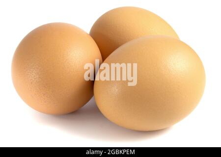 Three chicken eggs isolated on white background Stock Photo