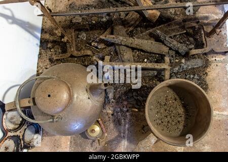 A fireplace under the chimney in the historic kitchen Stock Photo