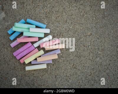 copy space with different colored chalks on the floor Stock Photo